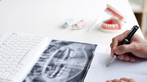 Patient configuring root canal cost in DuPont