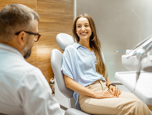 a patient speaking with their dentist