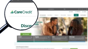 a magnifying glass over the CareCredit logo