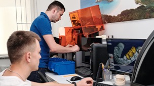 a dental lab using computer software to make a partial denture