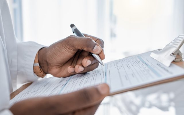 a person filling out their insurance information