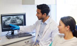 a dentist consulting with a patient about dental implants